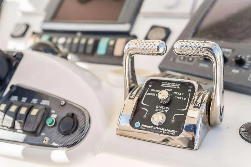Slide: The Image of Close-up of 2004 Riviera Convertible boat controls with dual levers and station select. - 4