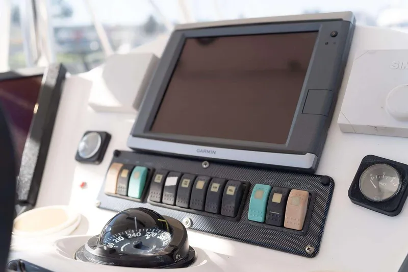 Slide: The Image of 2004 Riviera Convertible dashboard with Garmin display and navigation controls. - 5