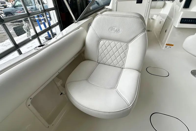 Slide: The Image of White cushioned seat on 2026 Key West 203 DFS boat, featuring diamond stitching. - 13