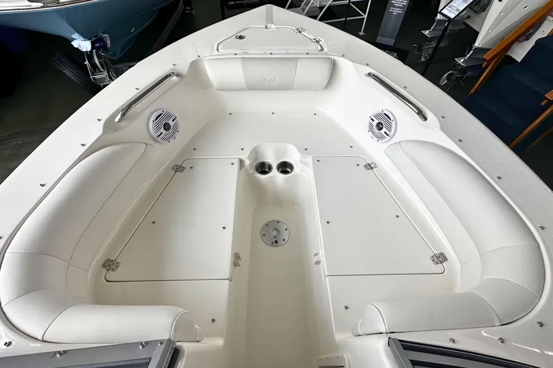 Slide: The Image of 2026 Key West 203 DFS boat interior with seating and storage compartments. - 23