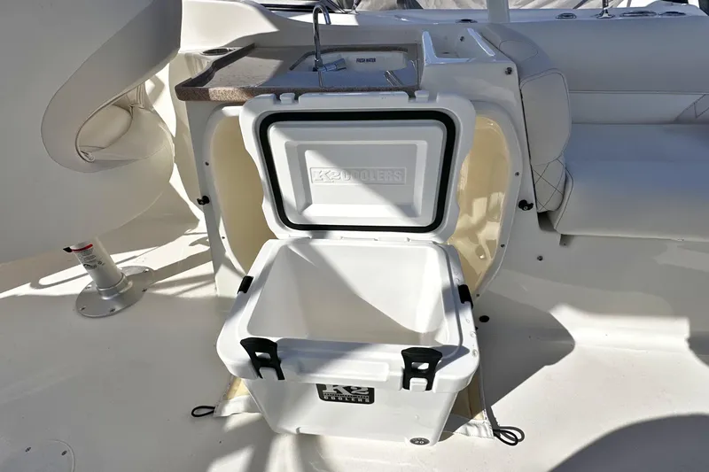 Slide: The Image of Open cooler on 2026 Key West 239 DFS boat, showcasing interior storage space. - 10