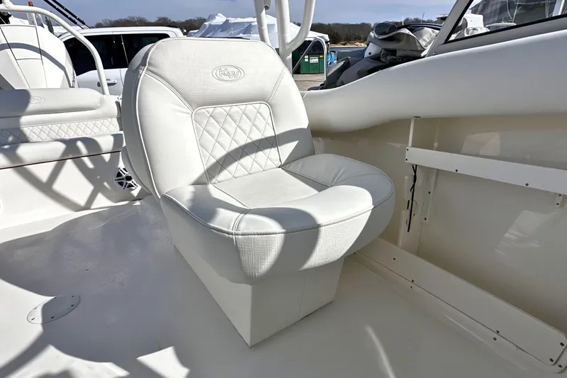 Slide: The Image of White seating on 2026 Key West 239 DFS boat, featuring elegant design and comfortable upholstery. - 12