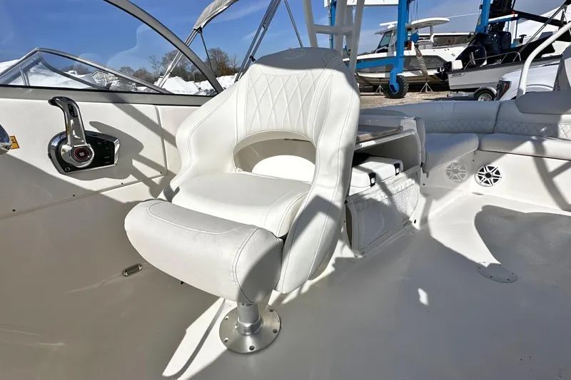 Slide: The Image of Interior of 2026 Key West 239 DFS boat with white seating and control panel. - 13