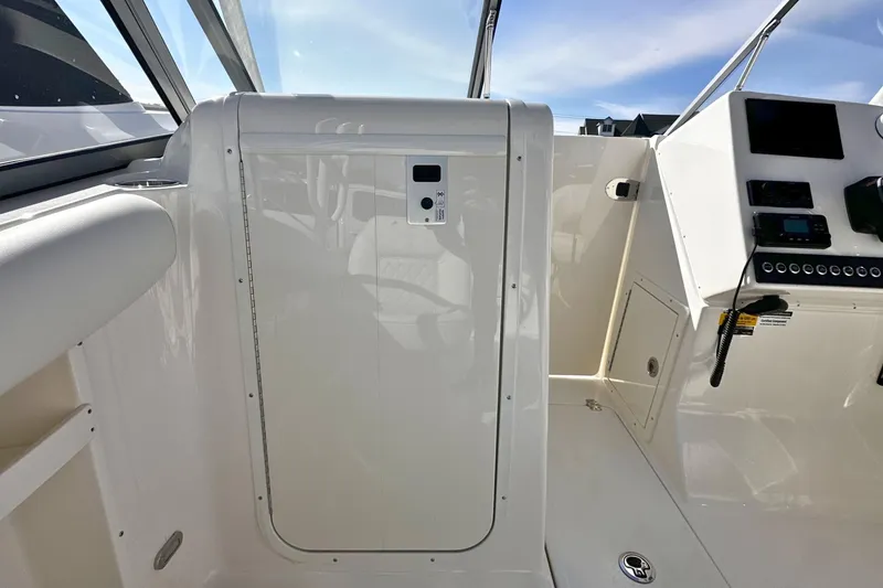 Slide: The Image of Interior view of 2026 Key West 239 DFS boat cockpit with control panel. - 17