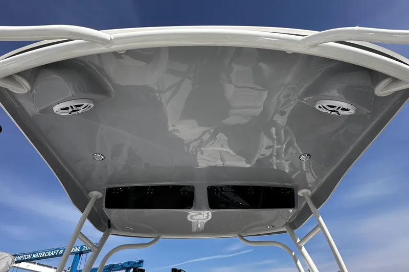 Slide: The Image of 2026 Key West 239 DFS boat canopy with speakers and blue sky background. - 19
