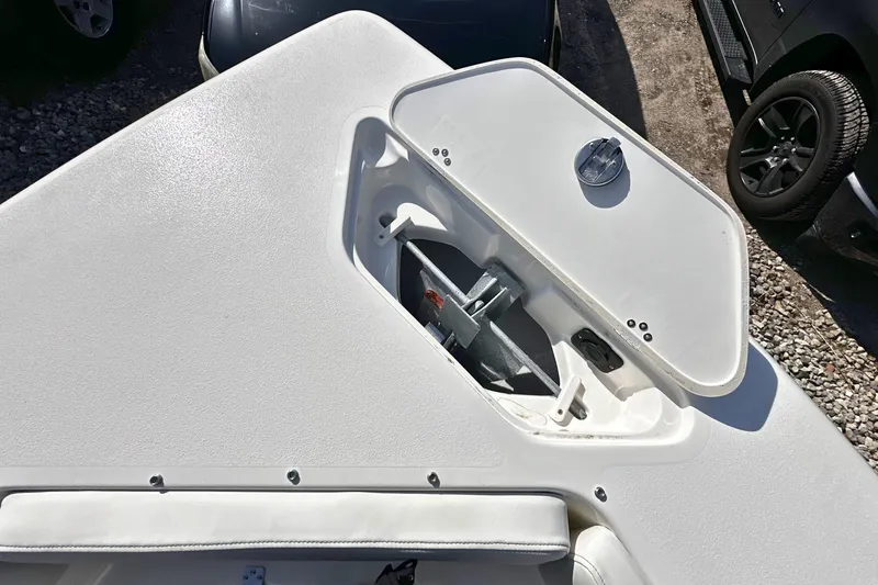 Slide: The Image of Open anchor compartment on 2026 Key West 239 DFS boat, showcasing storage design. - 25