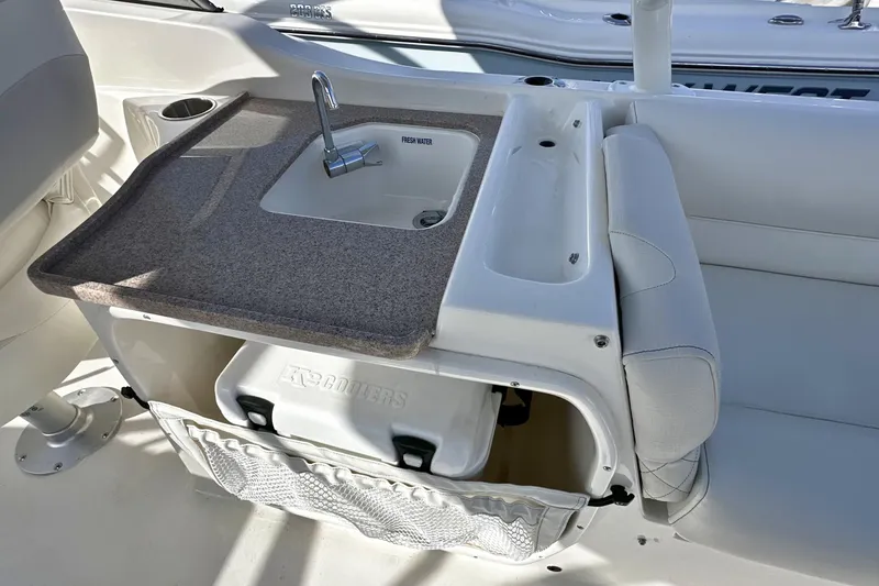 Slide: The Image of Interior of 2026 Key West 239 DFS boat featuring a sink and storage area. - 9