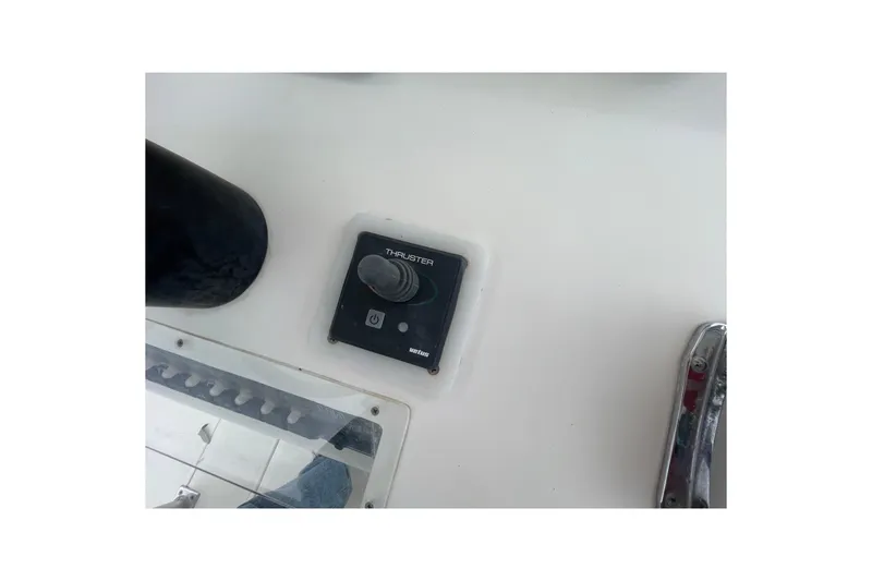 Slide: The Image of 2004 SeaVee 320i Cuddy thruster control panel on boat deck. - 13