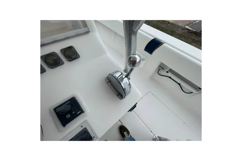 Slide: The Image of 2004 SeaVee 320i Cuddy boat helm with controls and gauges. - 14