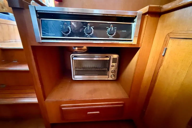 Slide: The Image of Built-in stove and toaster oven in a 1990 Mikelson 42 yacht kitchen. - 22