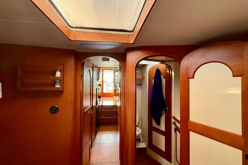 Slide: The Image of Interior of 1990 Mikelson 42 yacht, featuring wooden doors and skylight. - 30