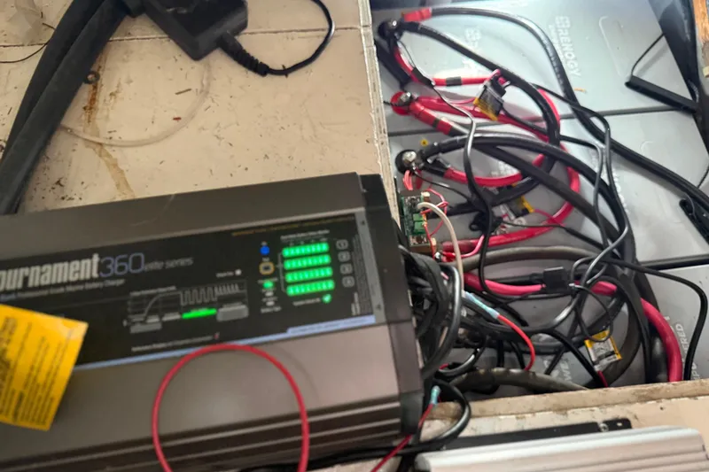 Slide: The Image of Battery charger and wiring inside a 1990 Mikelson 42 boat. - 33