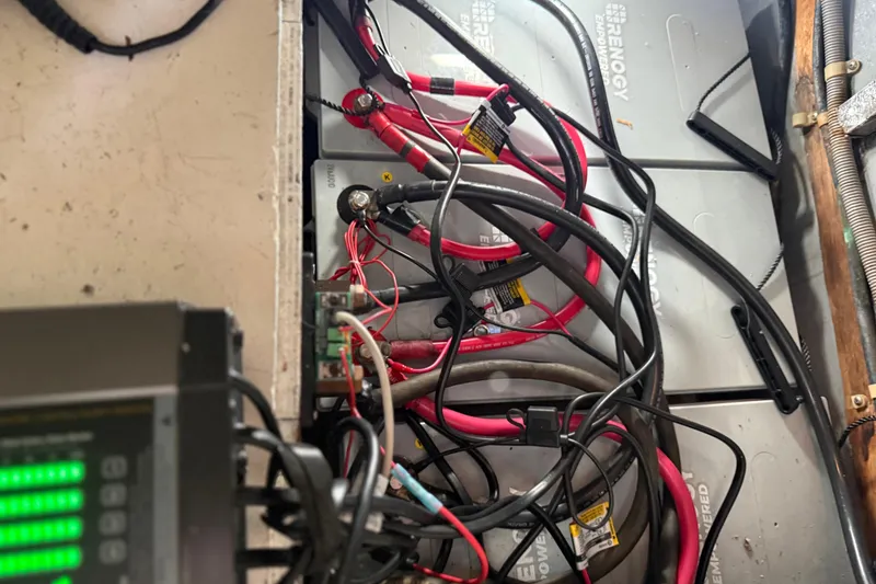 Slide: The Image of Battery setup with cables in a 1990 Mikelson 42 boat. - 34