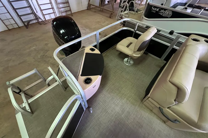 Slide: The Image of 2019 Sun Tracker Fishin' Barge 20 DLX interior with seating and motor. - 8