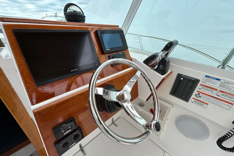 Slide: The Image of Steering console of a 2019 Limestone 26 boat with modern navigation equipment. - 11