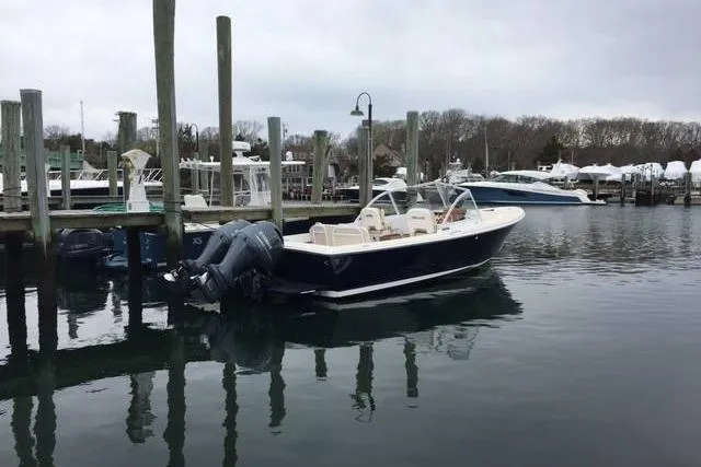 Slide: The Image of 2019 Limestone 26 boat docked in a marina with overcast skies. - 5