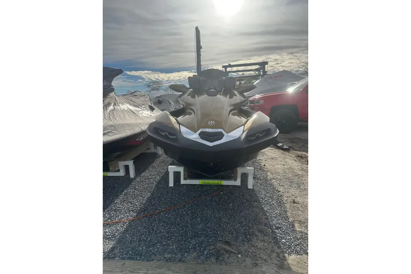 Slide: The Image of 2023 Kawasaki Jetski Ultra 310LX on display under a cloudy sky. - 2