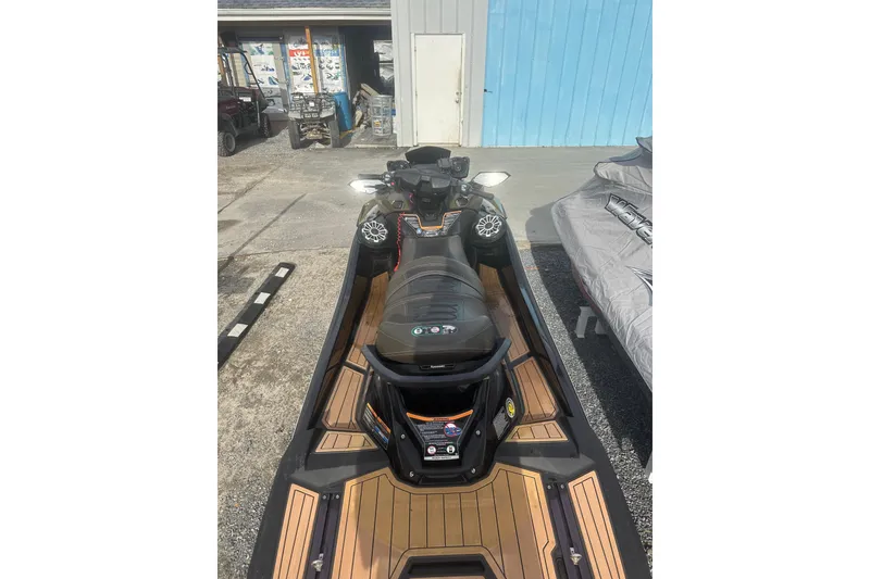 Slide: The Image of 2023 Kawasaki Jetski Ultra 310LX parked outdoors, showcasing sleek design and features. - 4