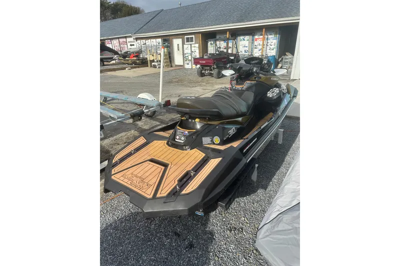 Slide: The Image of 2023 Kawasaki Jetski Ultra 310LX displayed outdoors, featuring sleek design and wooden accents. - 6