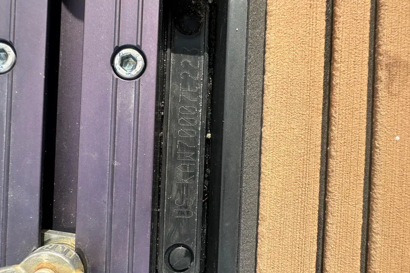 Slide: The Image of Close-up of 2023 Kawasaki Jetski Ultra 310LX identification plate and screws. - 9