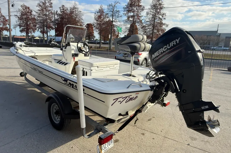 Slide: The Image of 2016 Mako Pro Skiff 17 CC boat with Mercury outboard motor on trailer. - 5