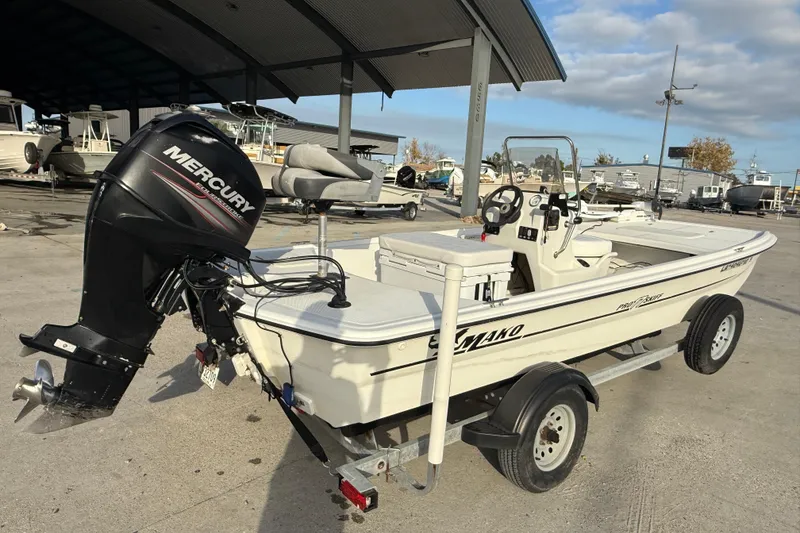 Slide: The Image of 2016 Mako Pro Skiff 17 CC boat with Mercury outboard motor on trailer. - 7