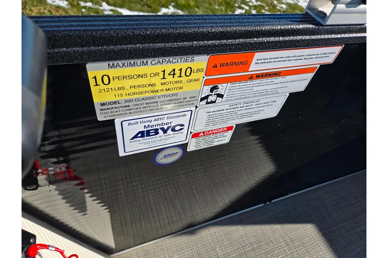 Slide: The Image of 2023 Crest Classic LX 200 capacity and safety labels, highlighting weight and passenger limits. - 15