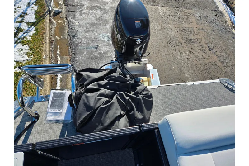 Slide: The Image of 2023 Crest Classic LX 200 boat with Suzuki outboard motor and accessories on deck. - 17