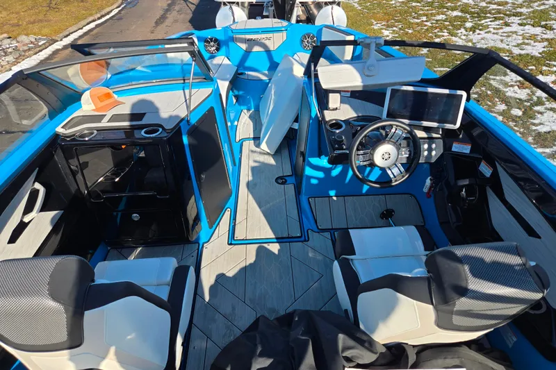 Slide: The Image of 2023 Yamaha Boats 222XD interior with modern dashboard and seating. - 11
