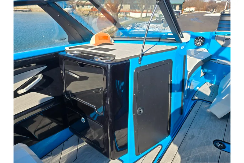 Slide: The Image of 2023 Yamaha Boats 222XD interior with blue accents and modern design. - 15