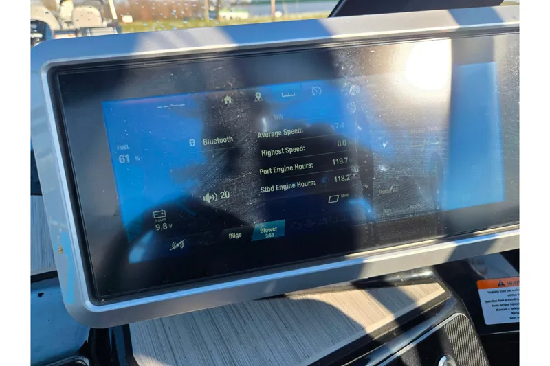 Slide: The Image of 2023 Yamaha Boats 222XD dashboard display showing fuel level and engine statistics. - 16