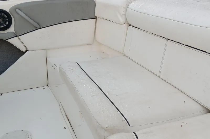 Slide: The Image of 2013 Bayliner 215 Bowrider interior with wet seats and dashboard view. - 10