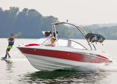 Slide: The Image of 2013 Bayliner 215 Bowrider dashboard with steering wheel and instrument panel. - 3