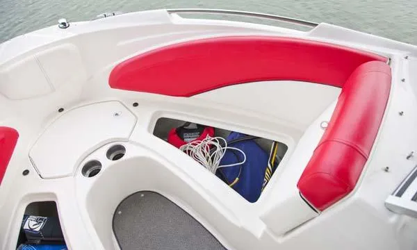 Slide: The Image of 2013 Bayliner 215 Bowrider on trailer, rear view, parked outdoors. - 4