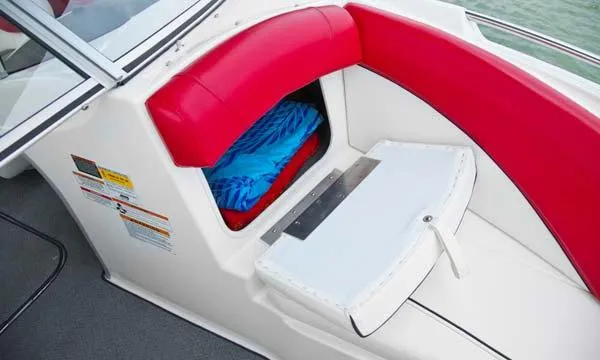 Slide: The Image of 2013 Bayliner 215 Bowrider interior with steering wheel, gauges, and seating. - 5