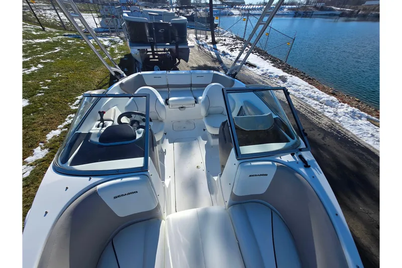Slide: The Image of 2011 Sea-Doo 180 Challenger SE boat docked by a snowy lakeside. - 20
