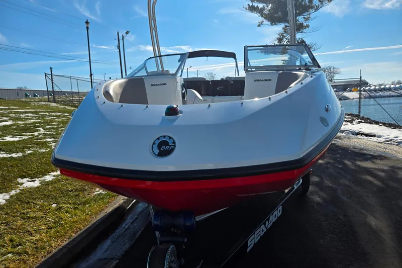 Slide: The Image of 2011 Sea-Doo Sport Boats 180 Challenger SE, docked on a sunny day by the water. - 6