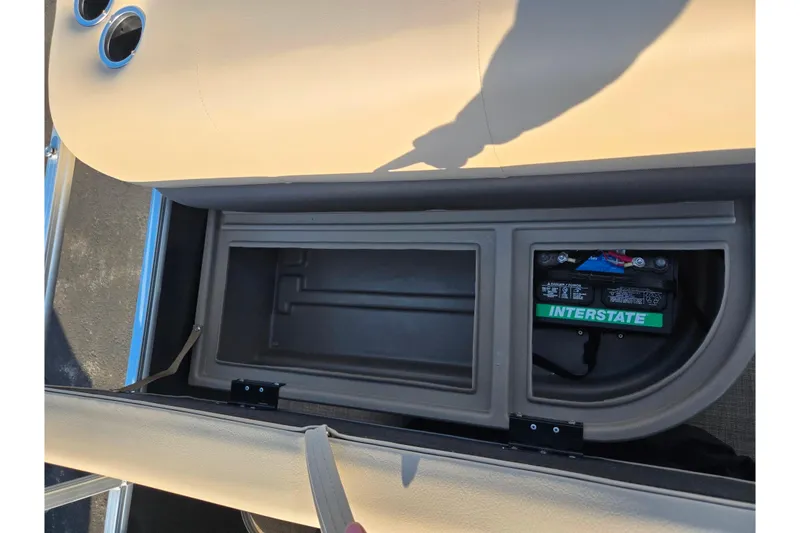 Slide: The Image of Storage compartment and battery in 2025 Sun Tracker Party Barge 18 DLX pontoon boat. - 16