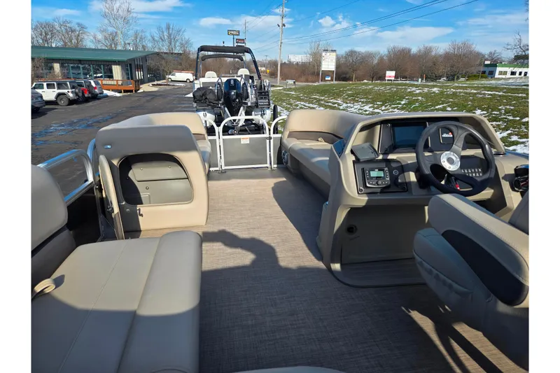 Slide: The Image of 2025 Sun Tracker Party Barge 18 DLX interior with spacious seating and modern dashboard. - 17