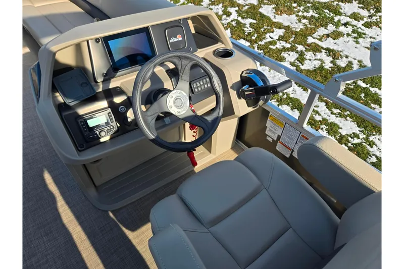 Slide: The Image of 2025 Sun Tracker Party Barge 18 DLX helm with steering wheel and controls. - 19