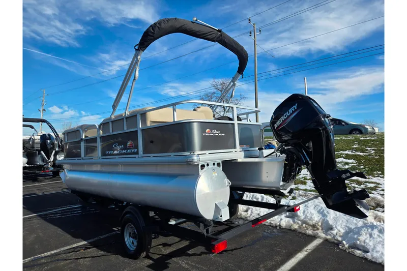 Slide: The Image of 2025 Sun Tracker Party Barge 18 DLX pontoon boat with Mercury engine on trailer. - 3
