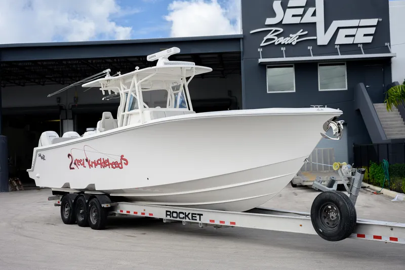 The Image of 2022 SeaVee 370Z boat on trailer outside SeaVee Boats facility. - 1