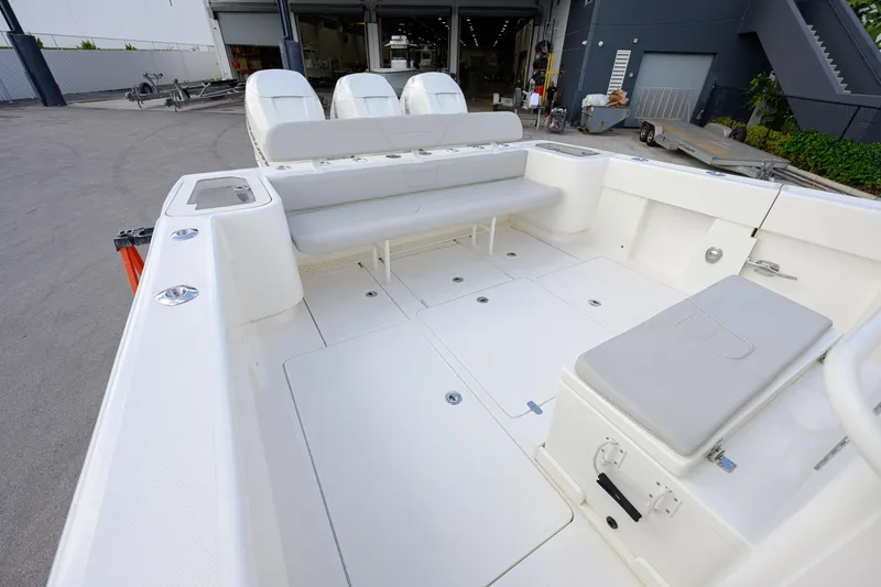 Slide: The Image of 2022 SeaVee 370Z boat interior with spacious seating and storage. - 12