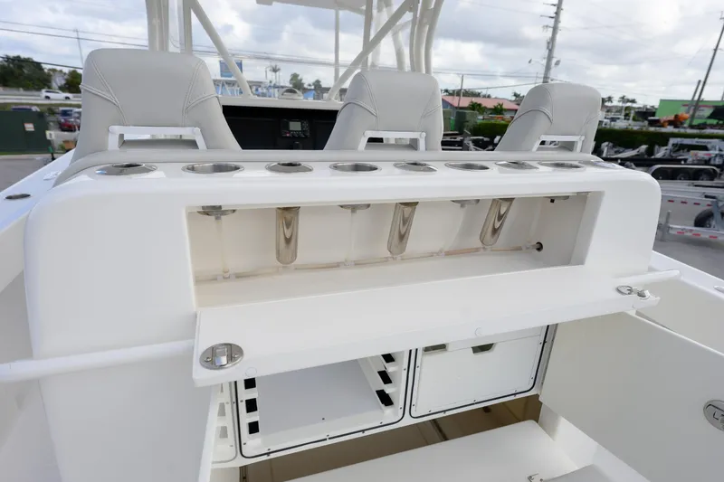 Slide: The Image of 2022 SeaVee 370Z boat interior with rod holders and storage compartments. - 14