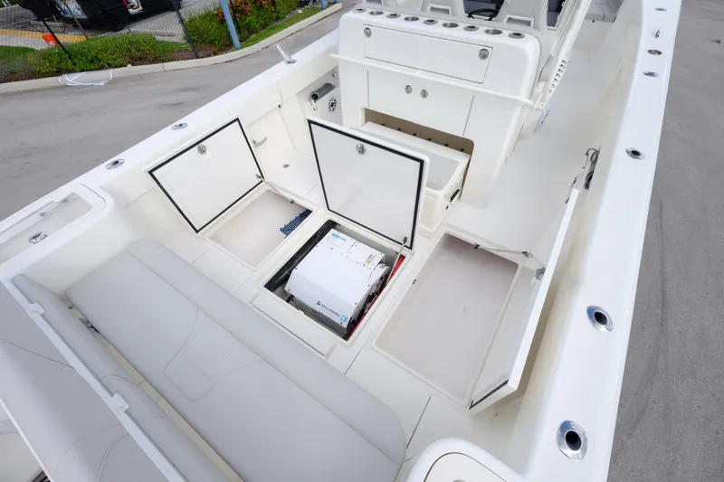 Slide: The Image of 2022 SeaVee 370Z boat interior with open storage compartments and seating. - 18