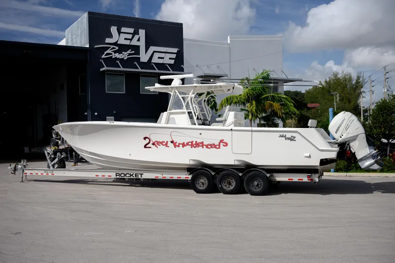 Slide: The Image of 2022 SeaVee 370Z boat on trailer outside SeaVee Boats facility. - 19