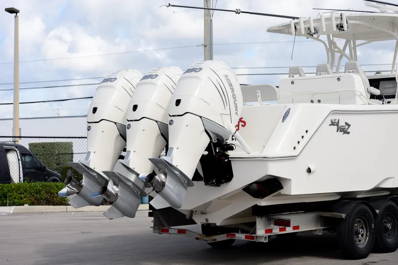 Slide: The Image of 2022 SeaVee 370Z boat with triple Mercury outboard engines on a trailer. - 5