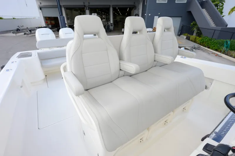 Slide: The Image of 2022 SeaVee 370Z boat with three white cushioned seats in the cockpit area. - 8