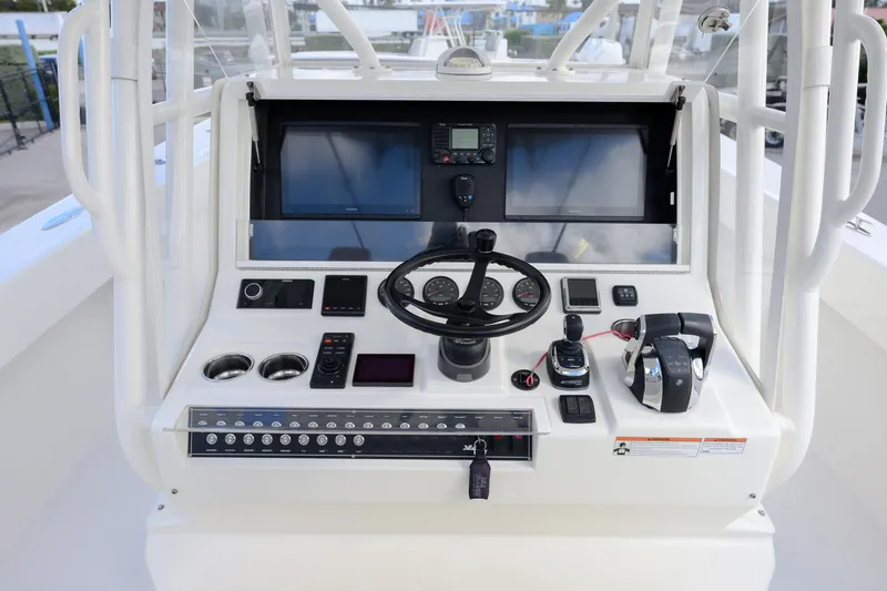Slide: The Image of 2022 SeaVee 370Z boat helm with advanced navigation and control systems. - 9