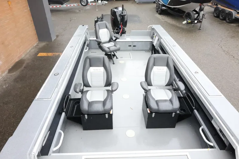 Slide: The Image of 2025 Thunder Jet 209 Rush OT boat interior with four seats and sleek design. - 16